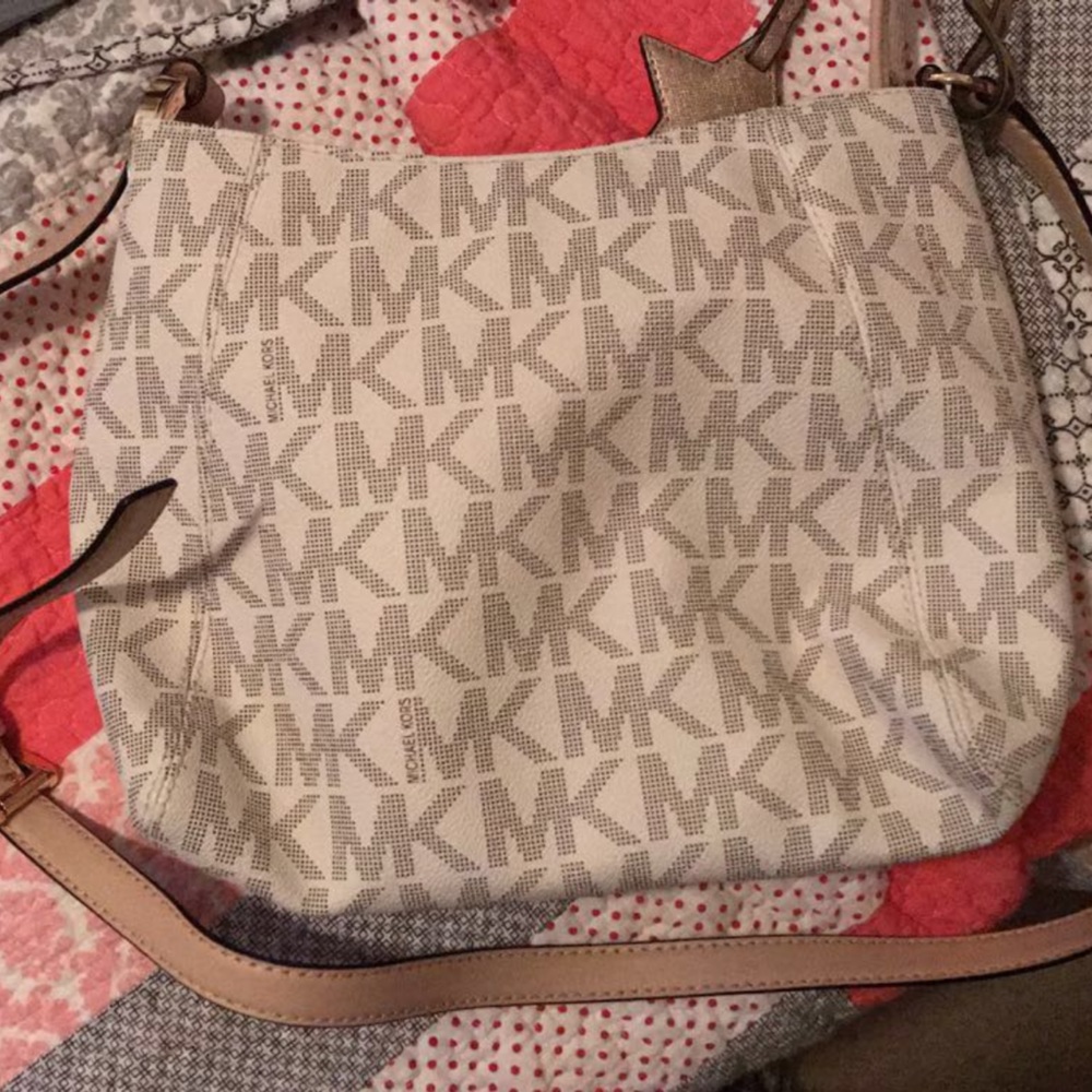 Michael Kors, crossbody purse, white with tan emblem all over.